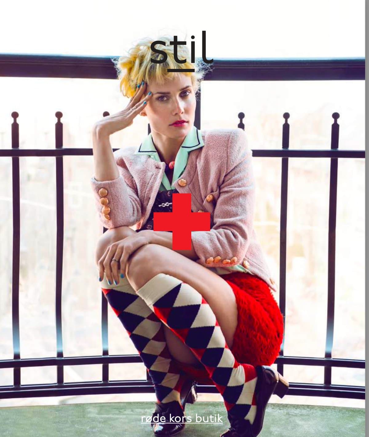 STIL magazine 2014 cover: singer Oh Land seated on a balcony in a pink jacket and argyle socks